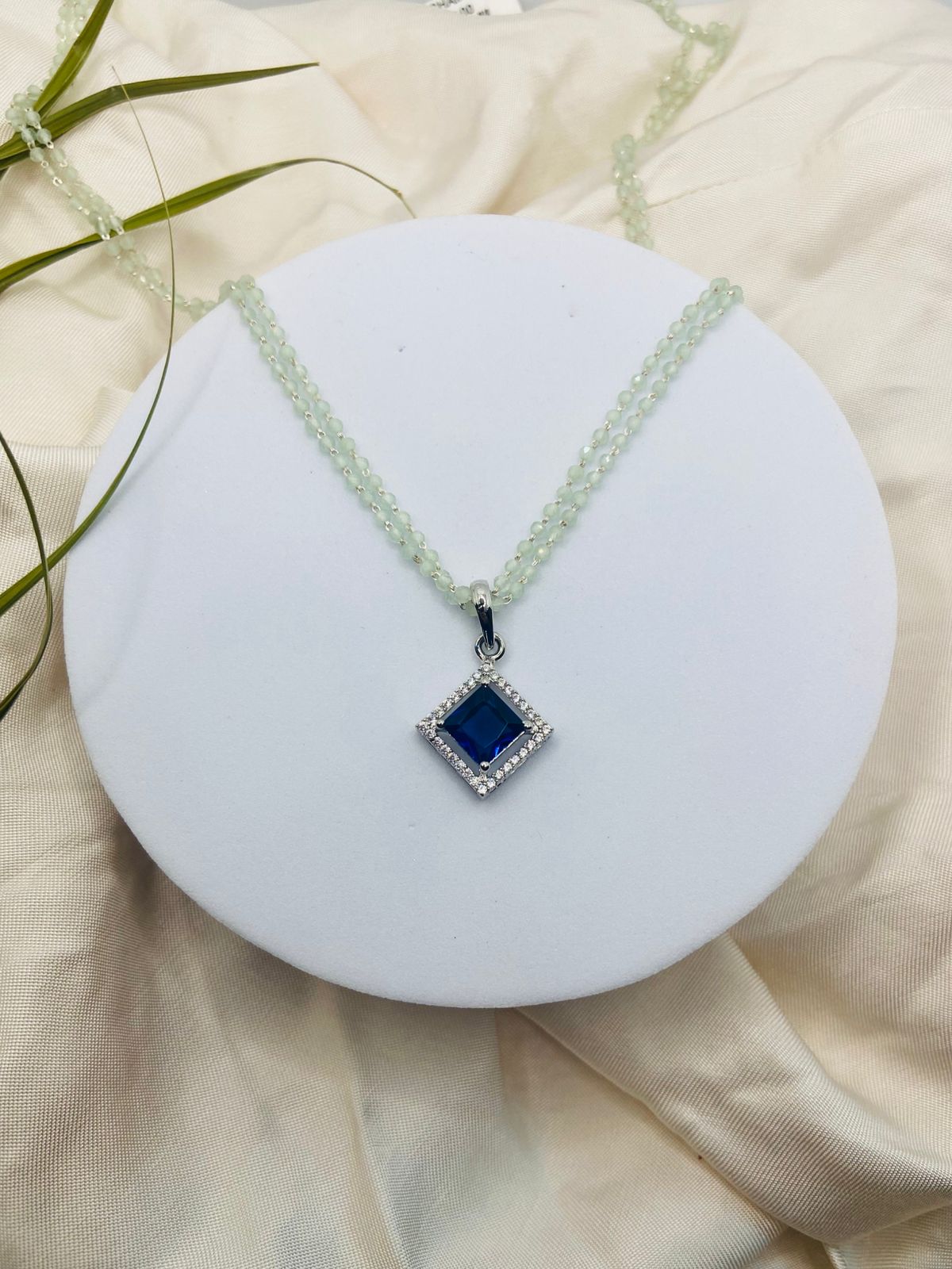 Sapphire Blue Diamond Stone Pendant paired with a delicate Green Pearl Chain