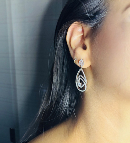 Silver Drop Oval Earrings - Intricate Design, Dazzling Movement NoorDazzle