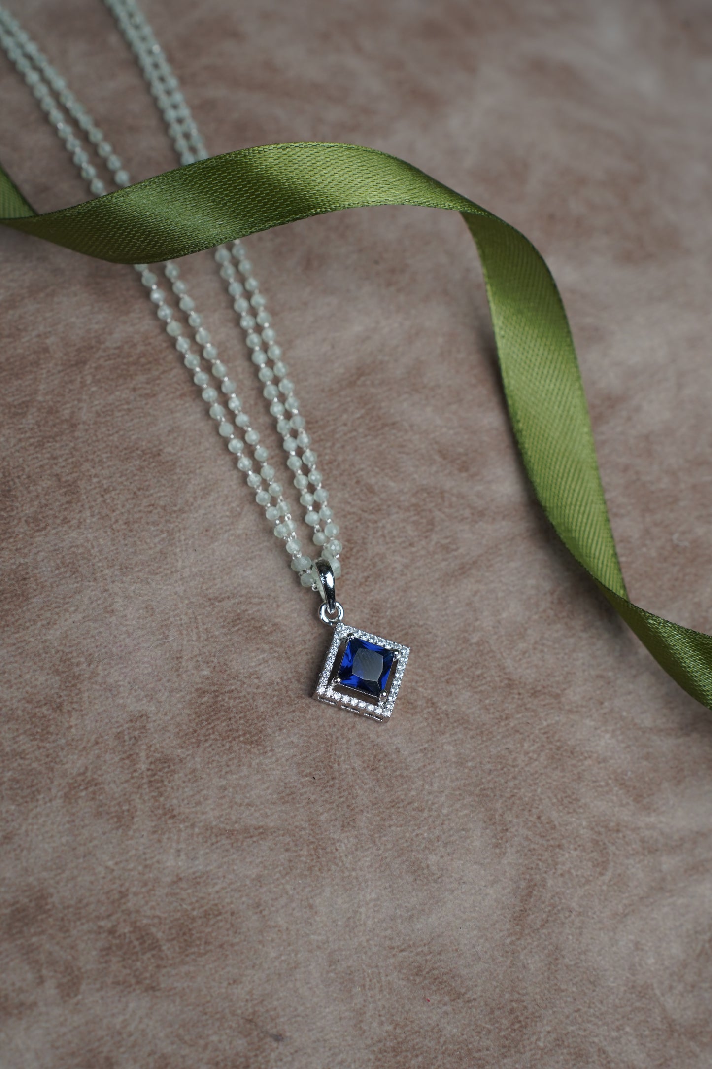 Sapphire Blue Diamond Stone Pendant paired with a delicate Green Pearl Chain